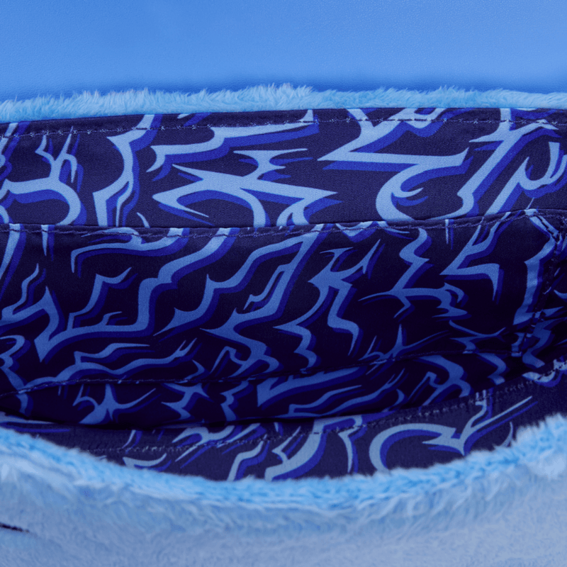 Coordinating lining detail inside the Loungefly KPop Demon Hunters Derpy bag