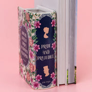Side view of ceramic book vase showing sculpted page detailing