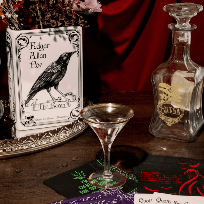 Large The Raven ceramic book vase styled on a shelf with books and dried flowers