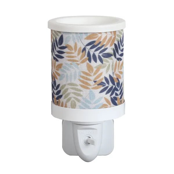 Leaves plug in wax melt burner with a neutral and navy leaf pattern and an on/off switch on the plug base.