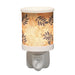 Leaves plug in wax melt burner switched on, glowing warmly through the leafy design.