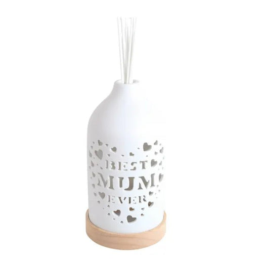 White ceramic Best Mum reed diffuser assembled on a wooden base with reed sticks in place.
