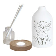 Reed diffuser set components showing the ceramic cover, wooden LED base, bottle and reed sticks.