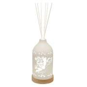 LED ceramic reed diffuser with glowing fairy and stars design and reed sticks

