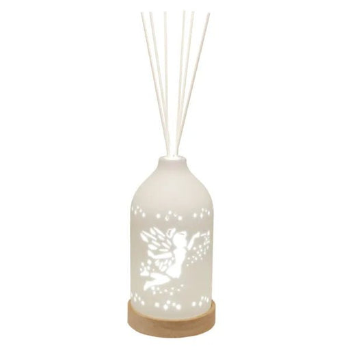 LED ceramic reed diffuser with glowing fairy and stars design and reed sticks

