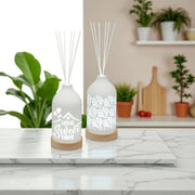 LED ceramic reed diffusers displayed on kitchen counter, one with fan pattern

