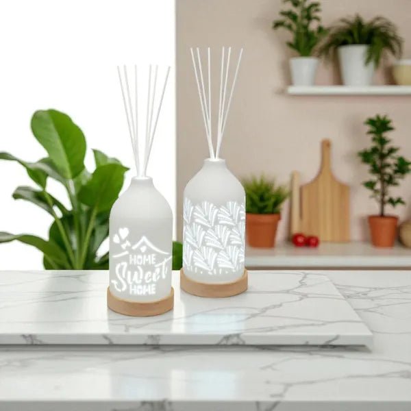 LED ceramic reed diffusers displayed on kitchen counter, one with fan pattern

