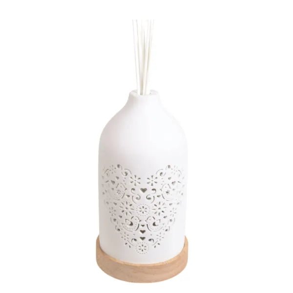 Unlit ceramic reed diffuser with heart-shaped floral pattern and wood base

