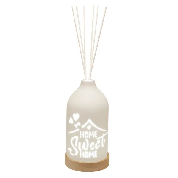 LED ceramic reed diffuser with Home Sweet Home cut-out lit on wood base


