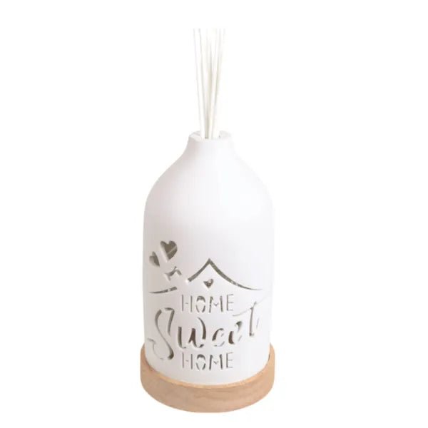 Unlit ceramic reed diffuser with Home Sweet Home message and reed sticks

