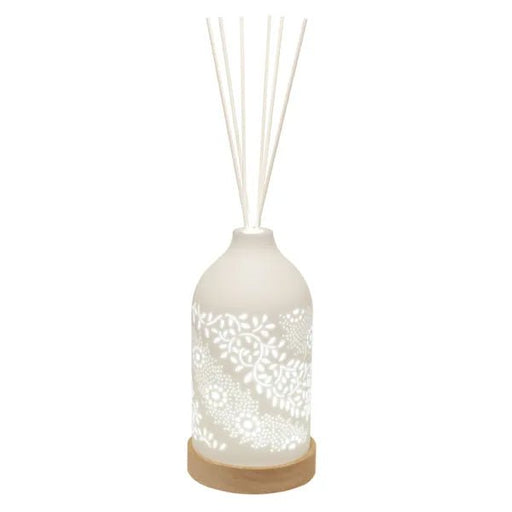 LED ceramic reed diffuser with glowing leaf and floral design and reed sticks