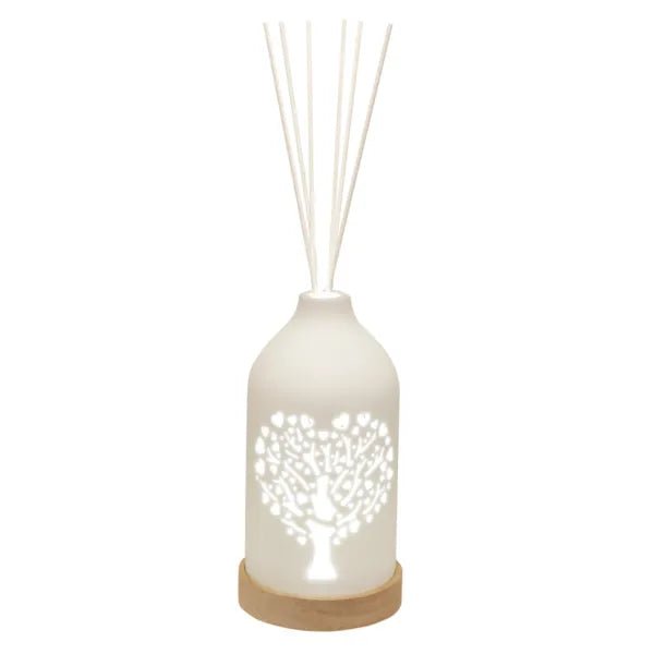 LED ceramic reed diffuser with glowing heart-shaped tree cut-out and reeds

