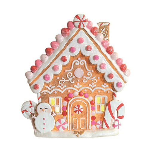 Pink LED gingerbread house 25cm with snowman, candy canes and frosted icing, lit with warm lights.