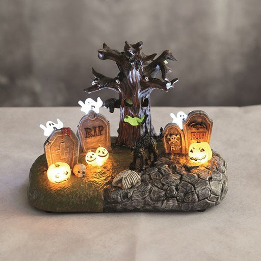 LED Halloween graveyard glowing on a tabletop display

