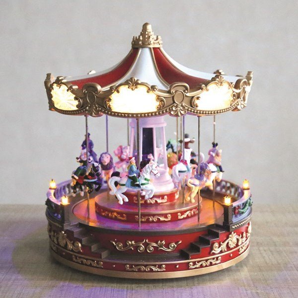 Illuminated Christmas carousel used as a festive centrepiece

