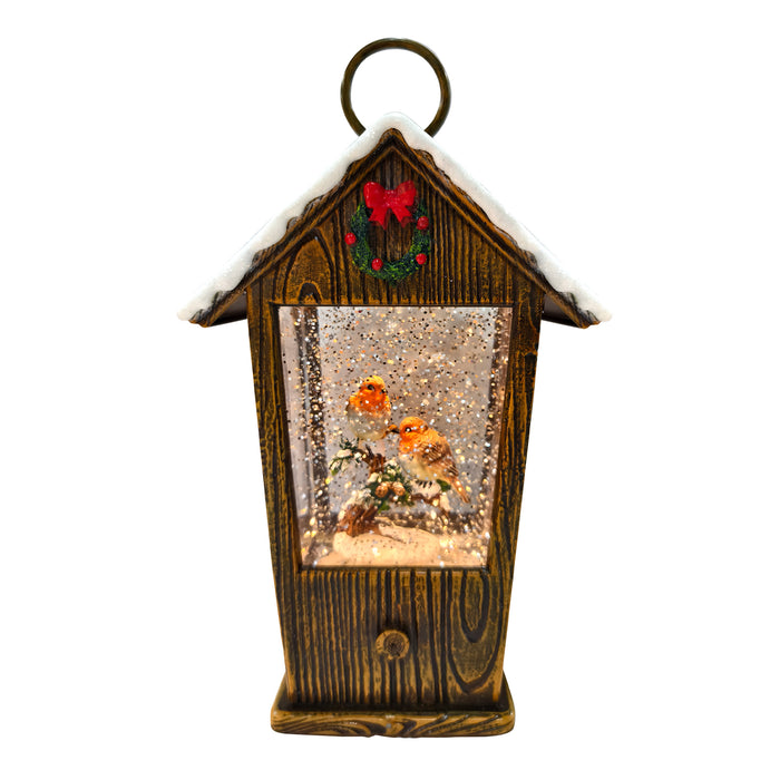 LED house lantern with two robins and swirling glitter snow, 25.5cm.

