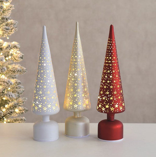 Trio of LED rotating star trees glowing in red, white and champagne.

