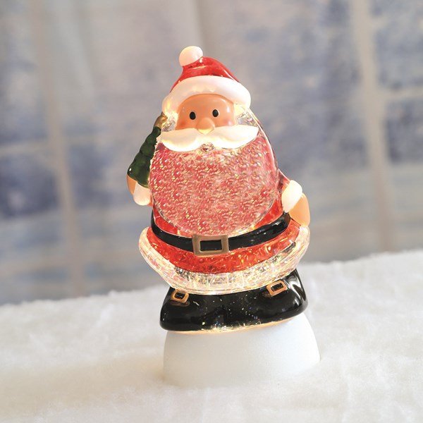 LED Santa glitter spinner glowing on a snowy display

