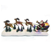 LED Santa sleigh with three moving reindeer on snowy base, 58x21cm

