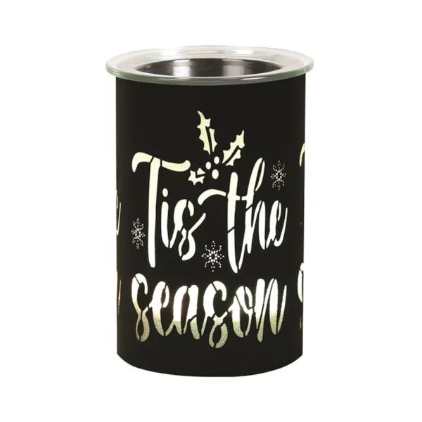 Black silhouette wax melter with warm white glow and glass top