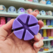 Purple Lemon Lavender segmented wax melt held in hand, close-up lifestyle image showing six wax melt sections