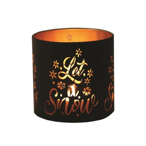 Round black and gold Let It Snow tealight candle holder shown glowing