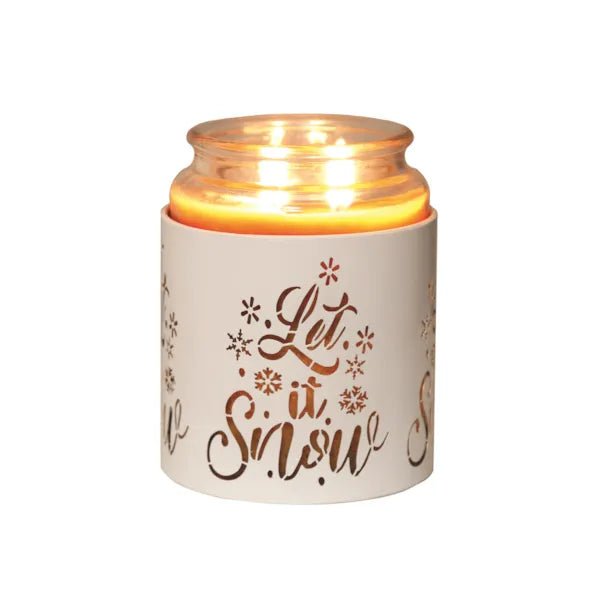 White Let It Snow sleeve used as a candle jar holder with lit jar inside