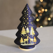 Light-up blue glass tree glowing with warm LEDs on a table

