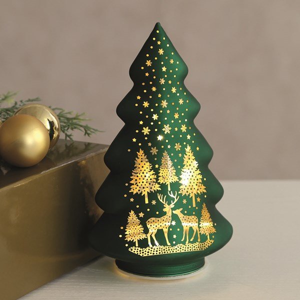 Light-up green glass tree glowing with warm LEDs on a table


