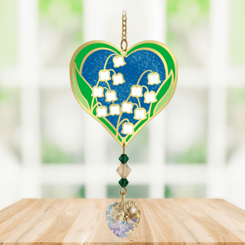 Heart-shaped Lily of the Valley Crystal Suncatcher with white bell flowers and prism heart catching sunlight in a window

