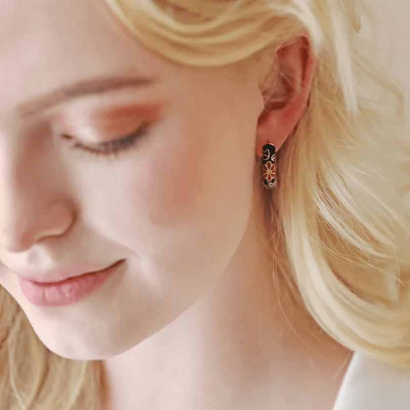 Lifestyle view of Lisa Angel black cloisonné hoop earrings being worn