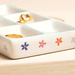 Close up of Lisa Angel blue bow and floral ceramic trinket tray with colourful flower details