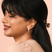 Model wearing Lisa Angel gold celestial moon and dangling star earrings