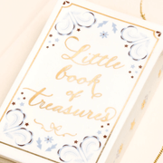 Close up of the Lisa Angel Little Book of Treasures ceramic trinket pot lid