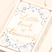 Close up of the Lisa Angel Little Book of Treasures ceramic trinket pot lid