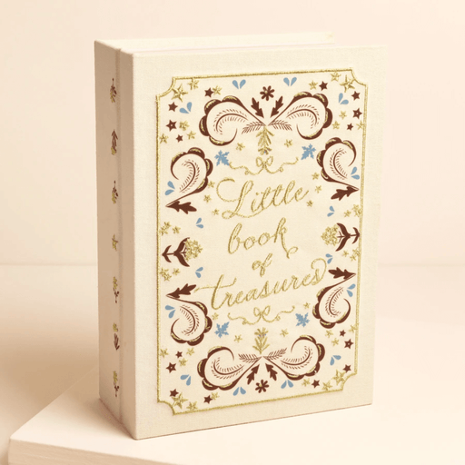 Cream linen book-style jewellery box with embroidered Little book of treasures cover design, shown standing upright.