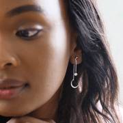 Model wearing Lisa Angel silver crystal star and crescent moon double drop earrings