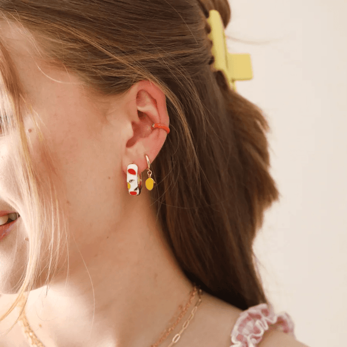 Lisa Angel Enamel Lemon huggie hoop earrings styled with gold hoops and colourful ear cuff
