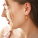 Lisa Angel Enamel Lemon gold huggie hoop earrings worn in ear