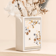 Back view of the Lisa Angel Little Book of Flower Buds ceramic book vase