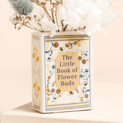 Close-up of the floral and bee cover on the Lisa Angel ceramic book vase