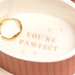Close up of Lisa Angel pink oval ceramic dog trinket pot with You’re pawfect message inside