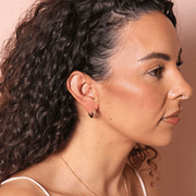 Lisa Angel Scattered Crystal Stars gold huggie hoop earrings worn by model