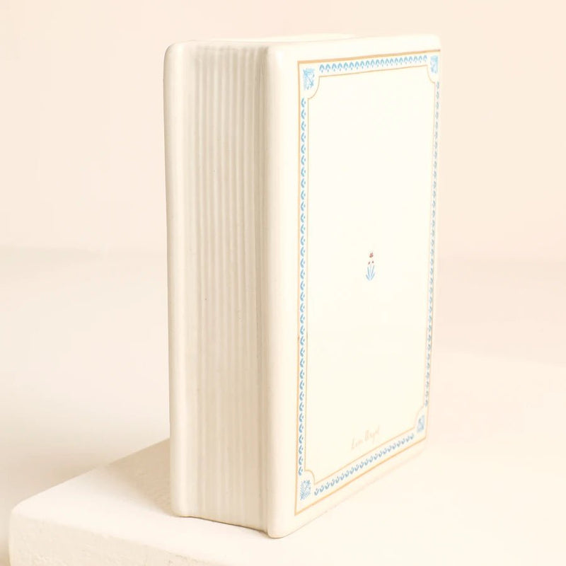 Side view of Tale as Old as Time ceramic book vase showing spine detail
