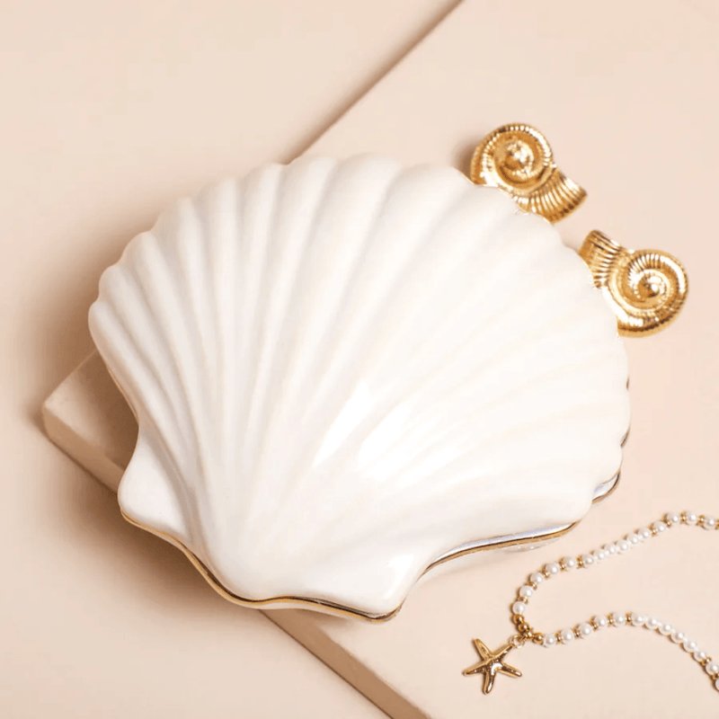 White ceramic shell trinket dish with removable lid and gold edging
