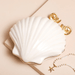 White ceramic shell trinket dish with removable lid and gold edging