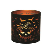 Lit jack-o’-lantern wax melt burner with bats glowing warmly

