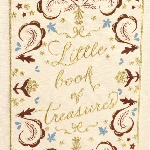 Close-up of embroidered Little book of treasures text and floral pattern on the cream linen jewellery box cover.
