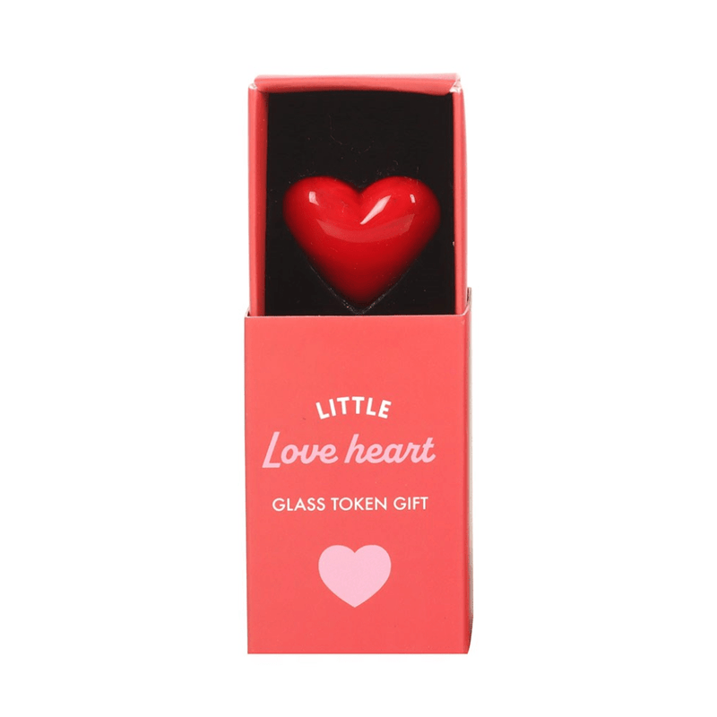 Mini red glass heart token nestled in coral pink sliding matchbox labelled Little Love.

