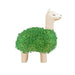 White llama-shaped chia planter with thick green leafy coat on white background